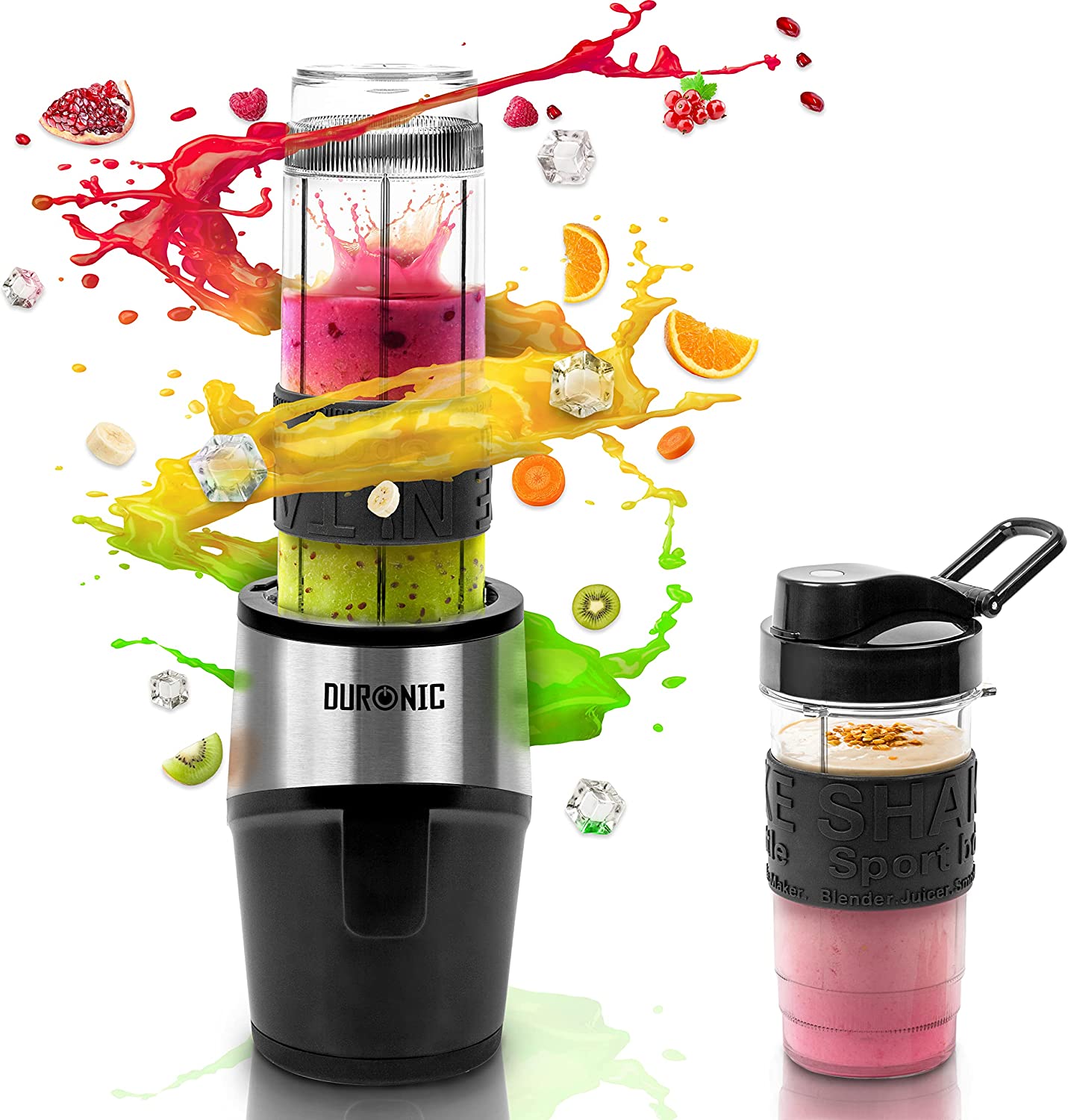 Duronic BL520 Mini Batidora de Vaso Individual 500W | Mostrando la mini batidora de vaso en funcionamiento con un vaso lleno de un batido de frutas rojo y verde, rodeada de salpicaduras de jugo, rodajas de fruta (granada, frambuesa, naranja, kiwi, plátano) y cubitos de hielo, junto a un vaso portátil adicional con asa y tapa a un lado