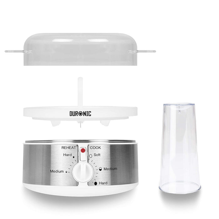Duronic EB35 WE Hervidor para huevos eléctrico | Mostrando una vista de despiece del hervidor de huevos, con la tapa transparente superior, la bandeja extraíble para huevos con asa central, la base calefactora de acero inoxidable con el panel de control frontal, y la taza medidora transparente a un lado