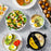 Duronic EB40 BK Hervidor de huevos Mostrando el hervidor en uso junto a varios platos preparados con huevos cocidos como ensaladas, tostadas con aguacate y desayunos