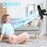 Duronic FN42 BK, ventilador de pared de 16 pulgadas de 50W, montado en la pared enviando una corriente de aire hacia una mujer sentada en el suelo de un salón, con los ojos cerrados disfrutando de la brisa