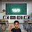 Duronic SFPS120 Pantalla de proyección de 120 Pulgadas Un niño en un aula señalando la pantalla de proyección instalada que muestra gráficos educativos en formato 16/9